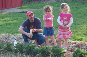 Man Laughing with Two Little Girls